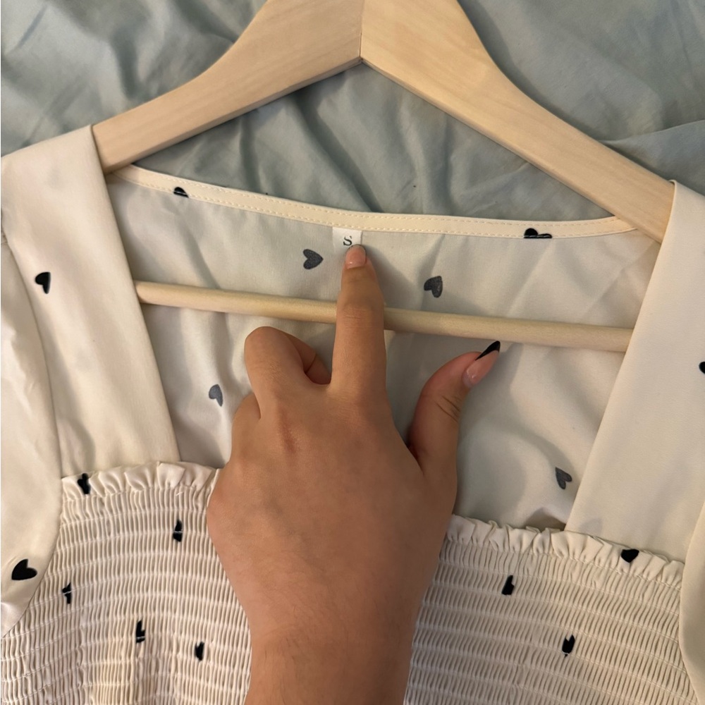 Elegant White Blouse with Black Heart Accents